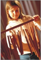 Child playing wood-chimes
